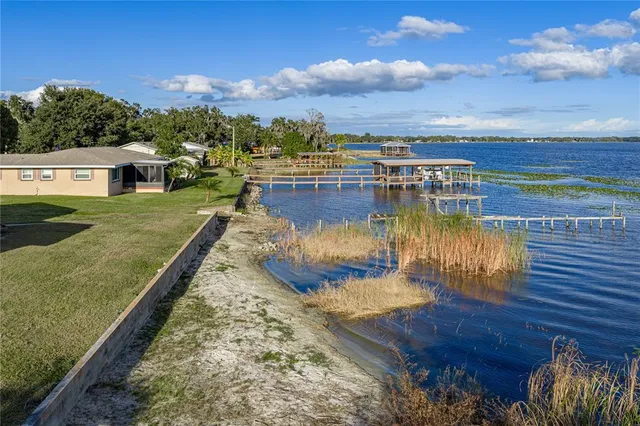 a view of a swimming pool with an outdoor seating