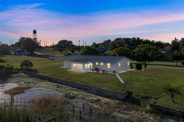 a view of a lake with houses in the back