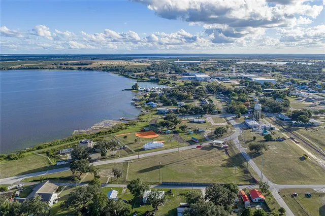 an aerial view of a house with a yard