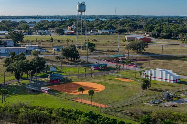 an aerial view of a house with a yard