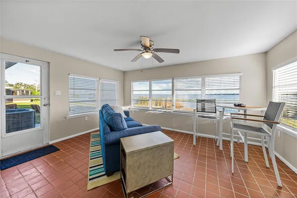 a living room with furniture a window and a table