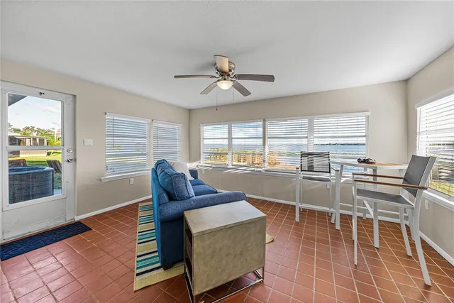 a living room with furniture a window and a table