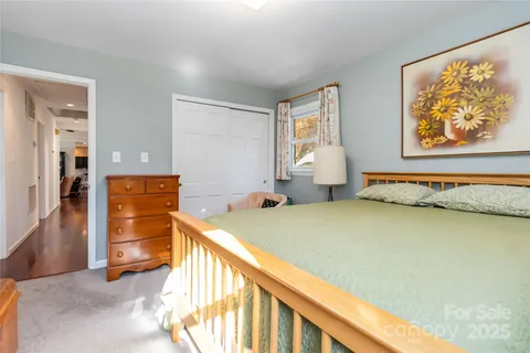 a bedroom with bed and window