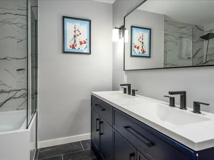 a bathroom with a sink and a mirror