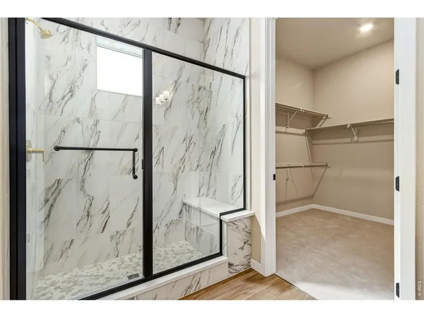 a bathroom with a sink vanity granite and a mirror