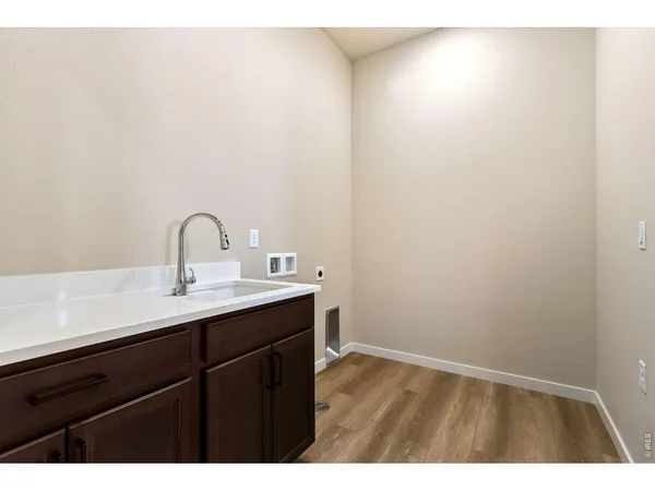 a view of a bathroom with a shower and a sink