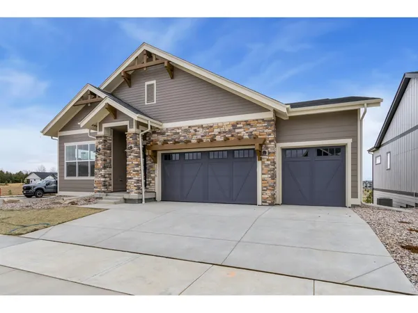 a front view of a house with a garage