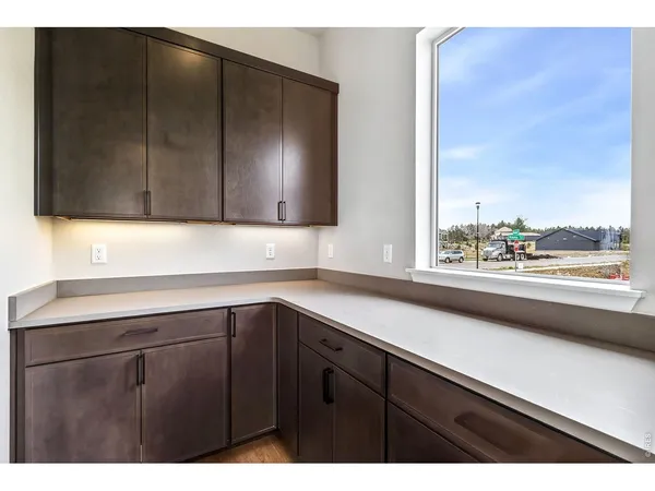 a kitchen with kitchen island a sink stainless steel appliances and cabinets