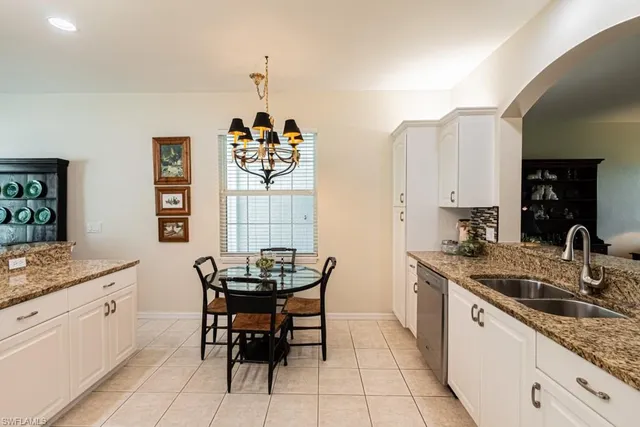 a kitchen with stainless steel appliances granite countertop a stove microwave and refrigerator