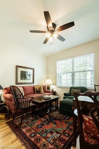a living room with furniture and a window