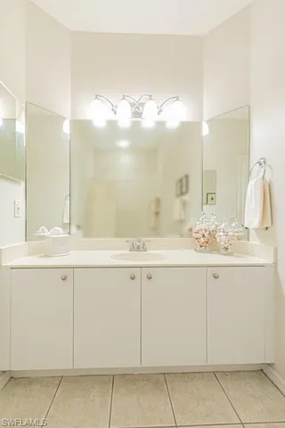a bathroom with a sink and mirror