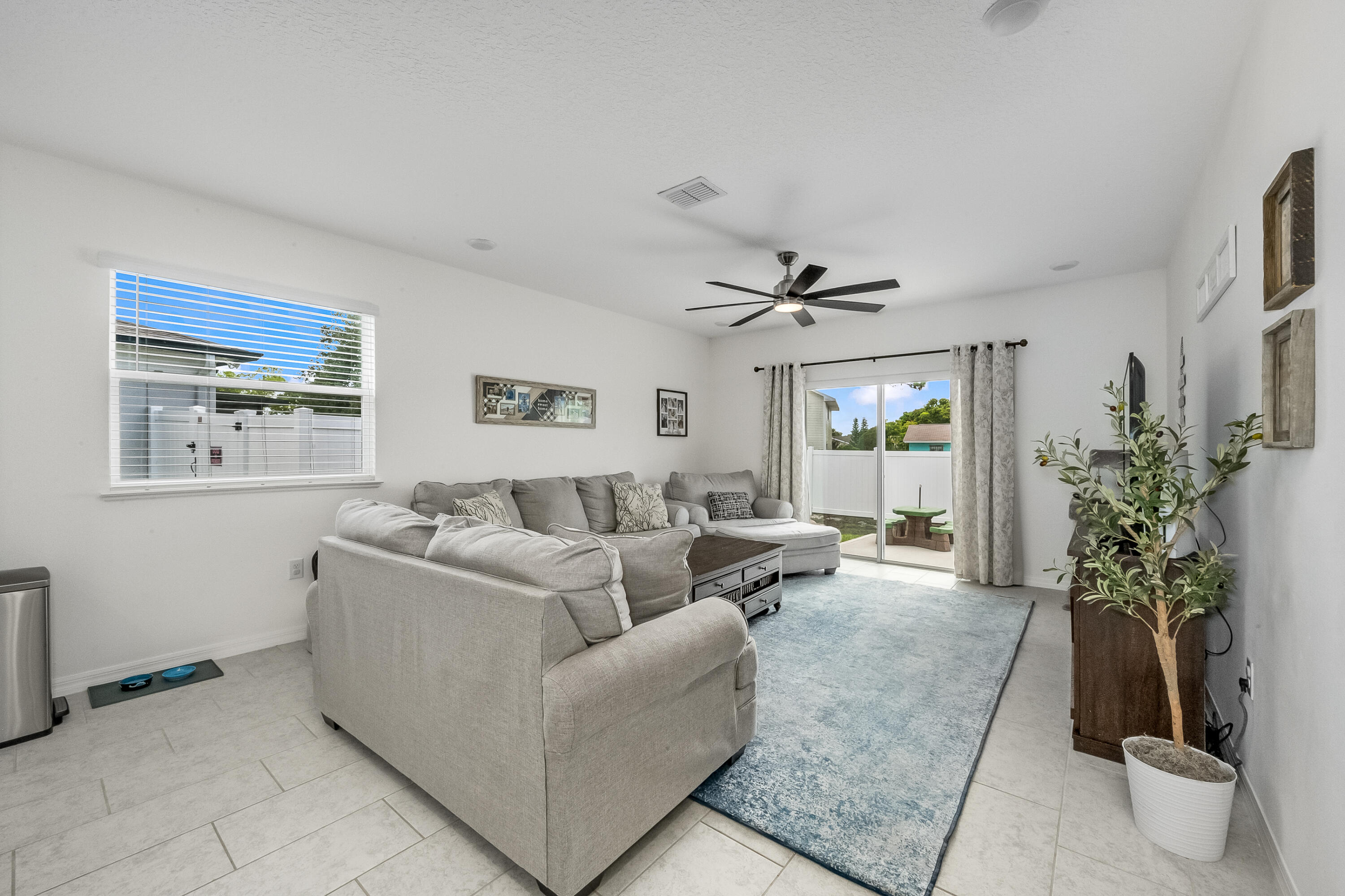 953 Edensor Lane Rockledge, FL 32955 - Photo 11 of 39 a living room with furniture and a potted plant