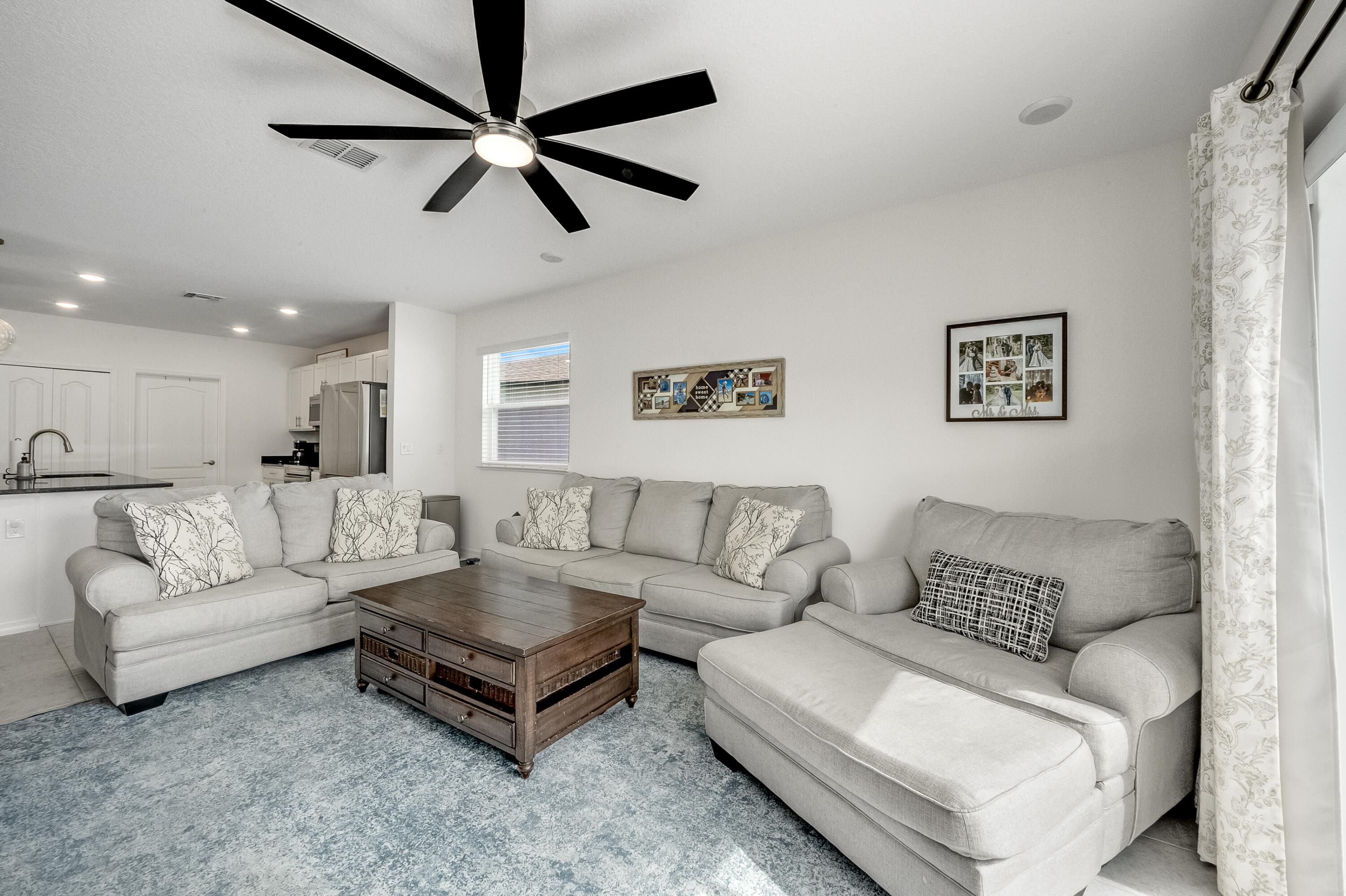 953 Edensor Lane Rockledge, FL 32955 - Photo 13 of 39 a living room with furniture and a ceiling fan