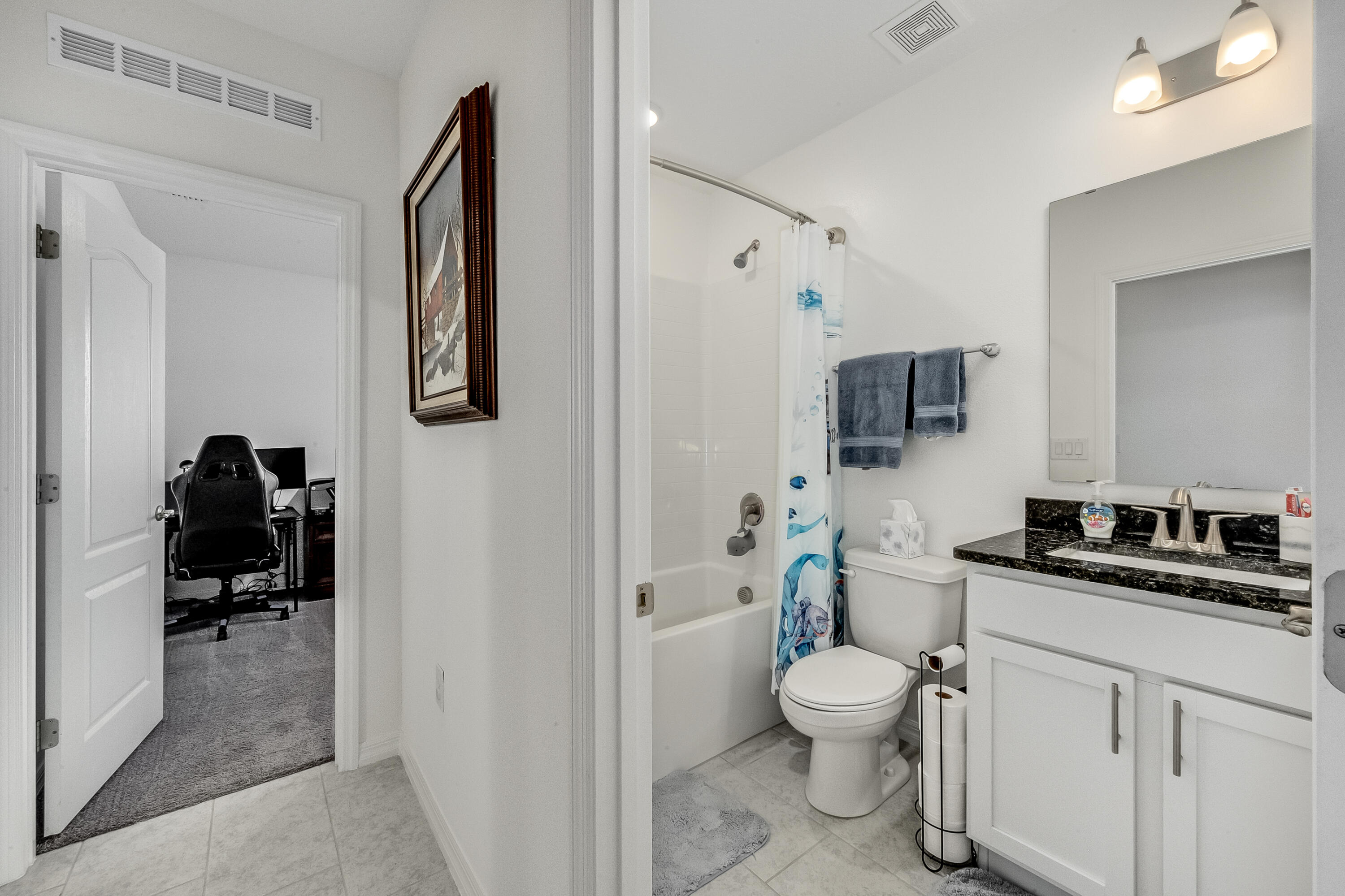 953 Edensor Lane Rockledge, FL 32955 - Photo 23 of 39 a bathroom with a toilet a sink and mirror