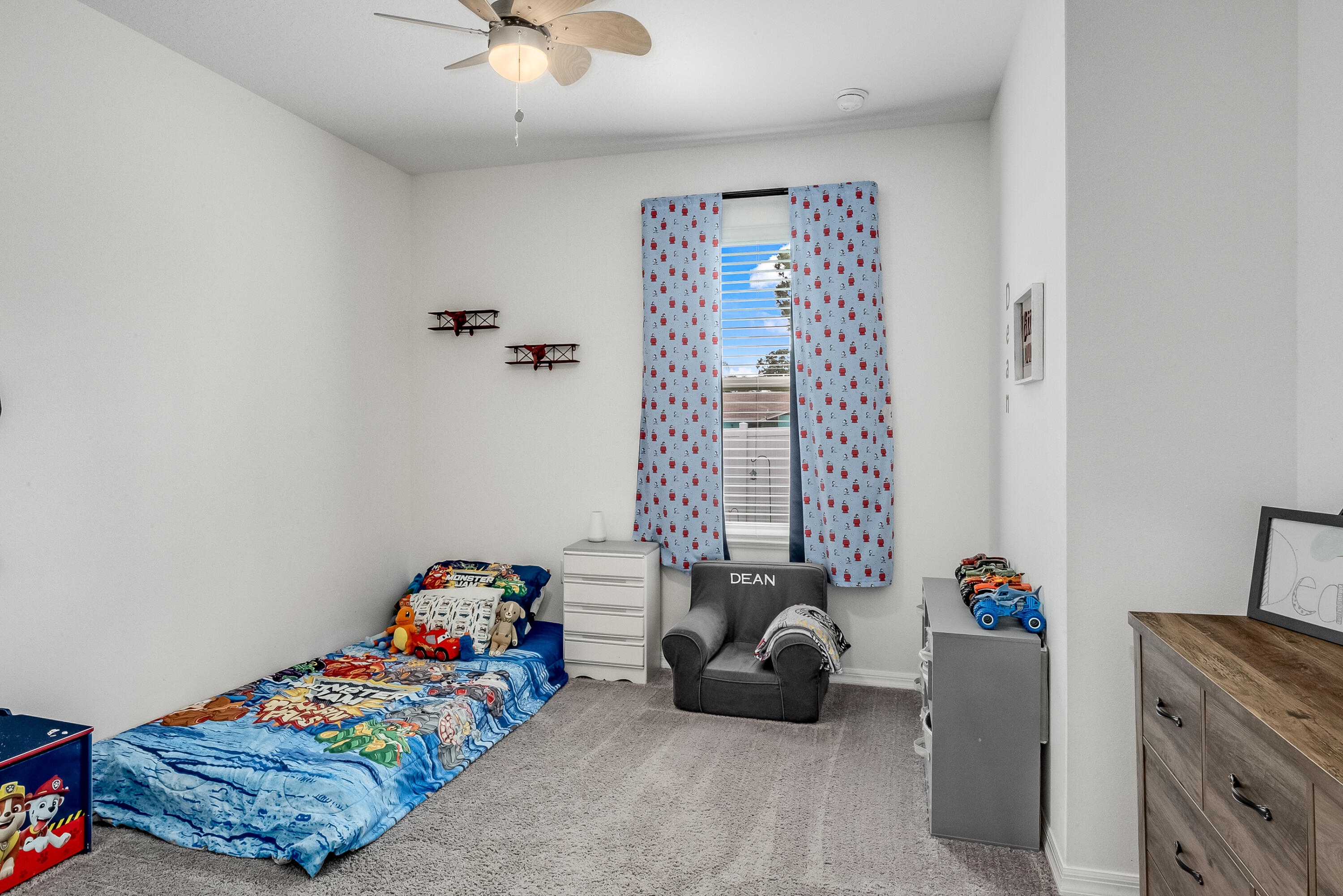 953 Edensor Lane Rockledge, FL 32955 - Photo 26 of 39 a bedroom with a bed and a chandelier