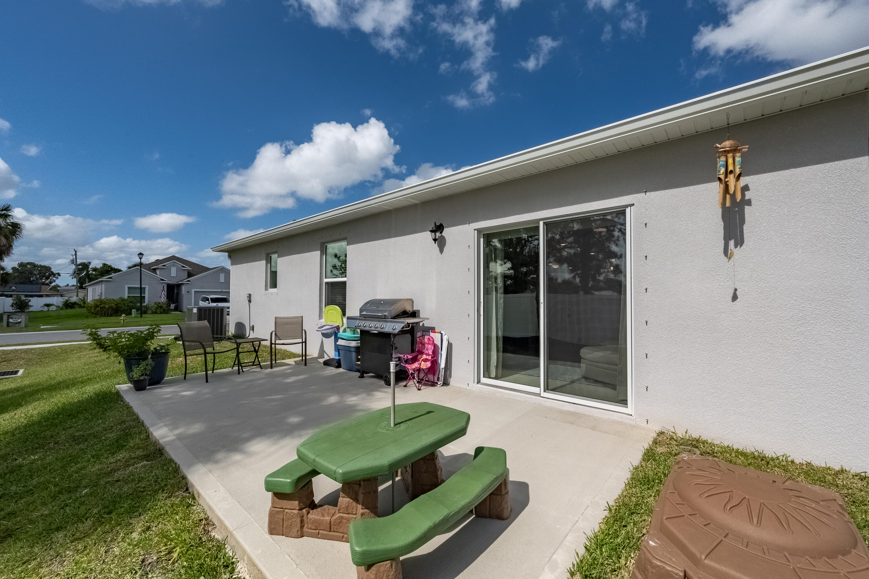 953 Edensor Lane Rockledge, FL 32955 - Photo 30 of 39 a view of a porch with furniture and a yard