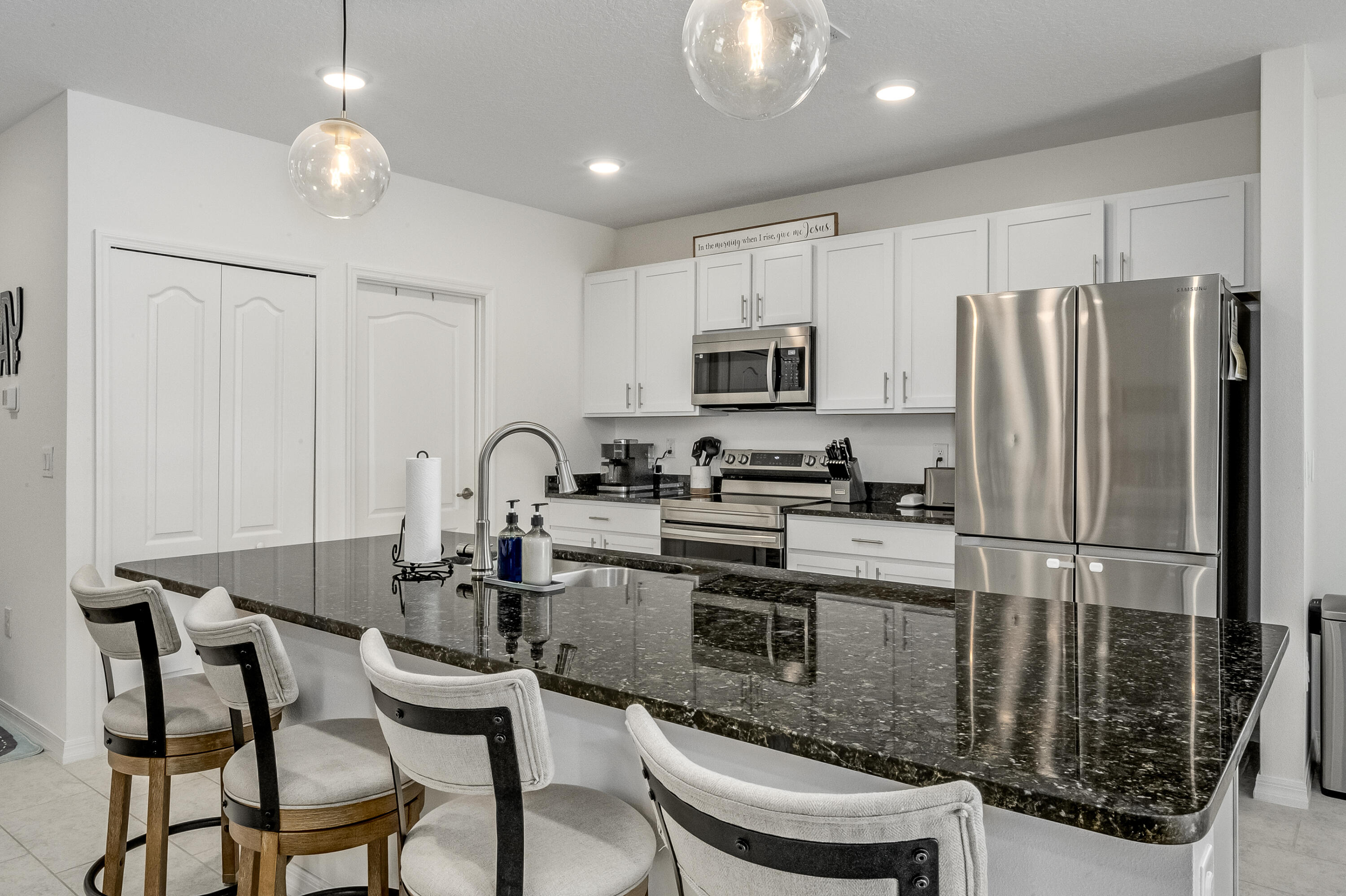 953 Edensor Lane Rockledge, FL 32955 - Photo 10 of 39 a kitchen with kitchen island a appliances cabinets and a counter top space