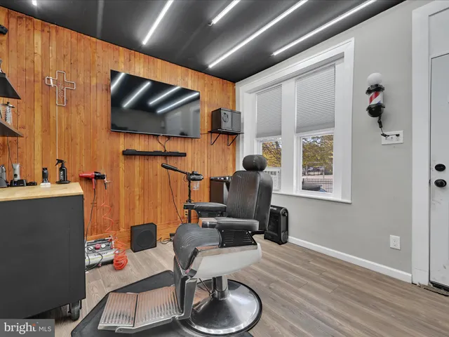 a room with furniture and flat screen tv