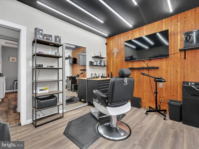 a room with furniture and gym equipment