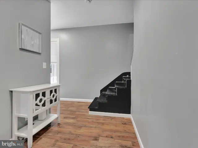 a view of a hallway with stairs