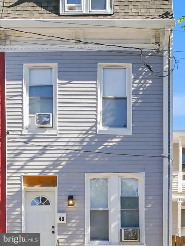 a view of a brick house with a large windows