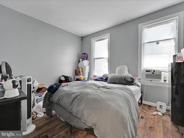 a bed room with a bed and a window