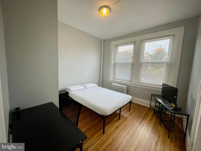 a room with a desk and a window