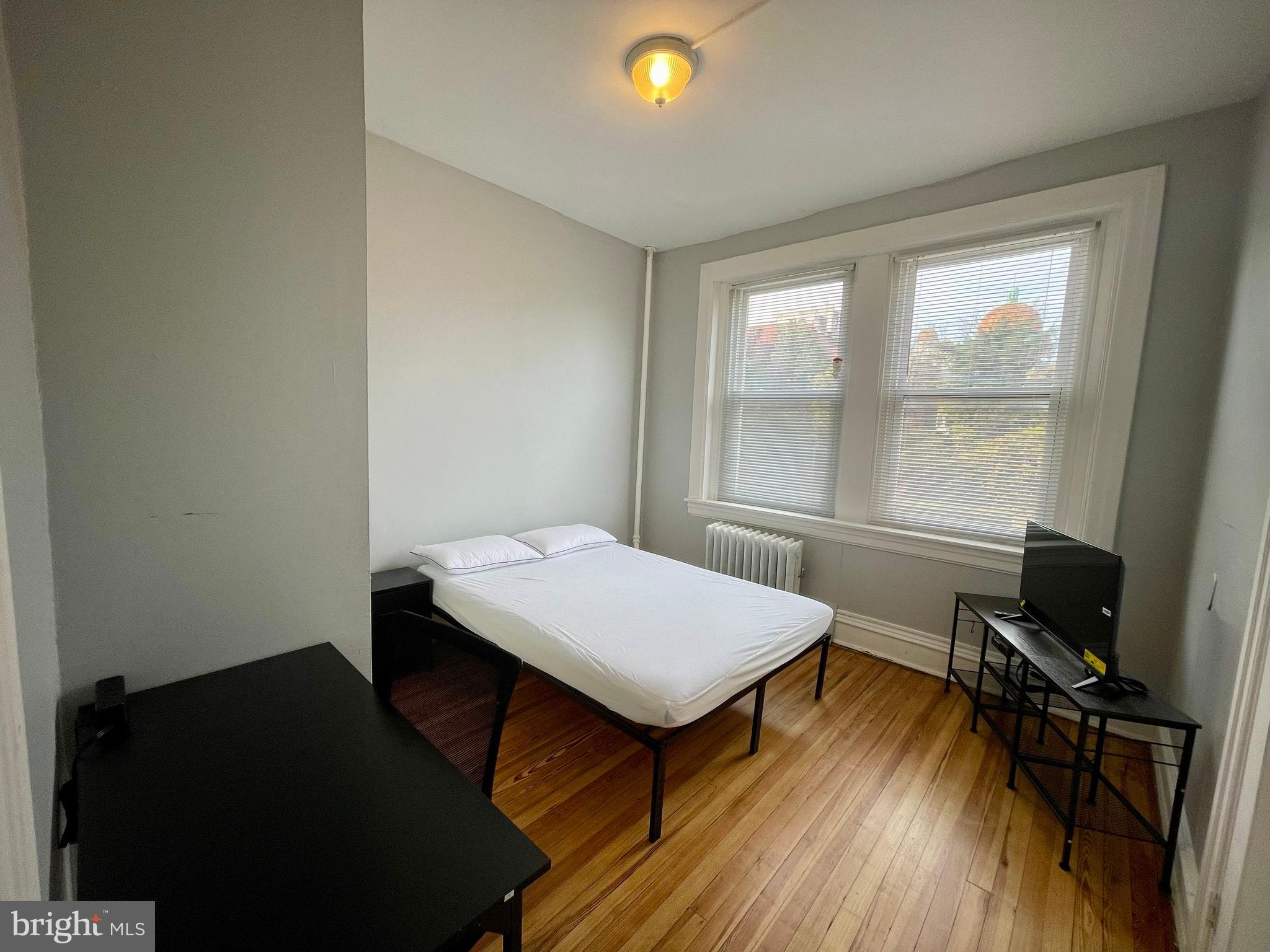 307 Dolphin Street, Unit 2B Baltimore, MD 21201 - Photo 15 of 17 a room with a desk and a window