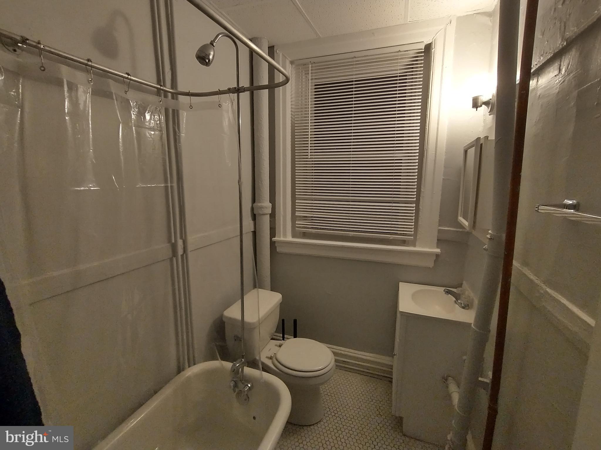 307 Dolphin Street, Unit 2B Baltimore, MD 21201 - Photo 17 of 17 a bathroom with a toilet and shower