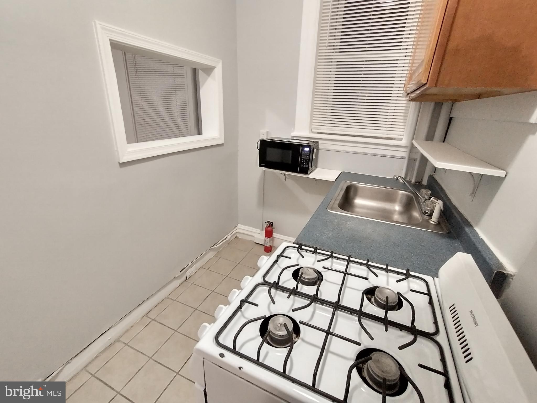 307 Dolphin Street, Unit 2B Baltimore, MD 21201 - Photo 2 of 17 a view of a living room and a window