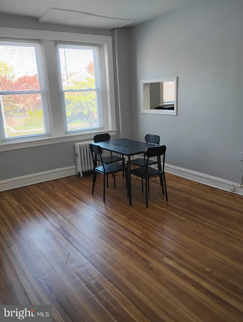 307 Dolphin Street, Unit 2B Baltimore, MD 21201 - Photo 3 of 17 a view of a work space with wooden floor and a window