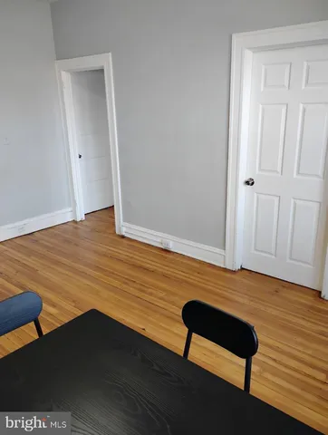 a view of room with wooden floor