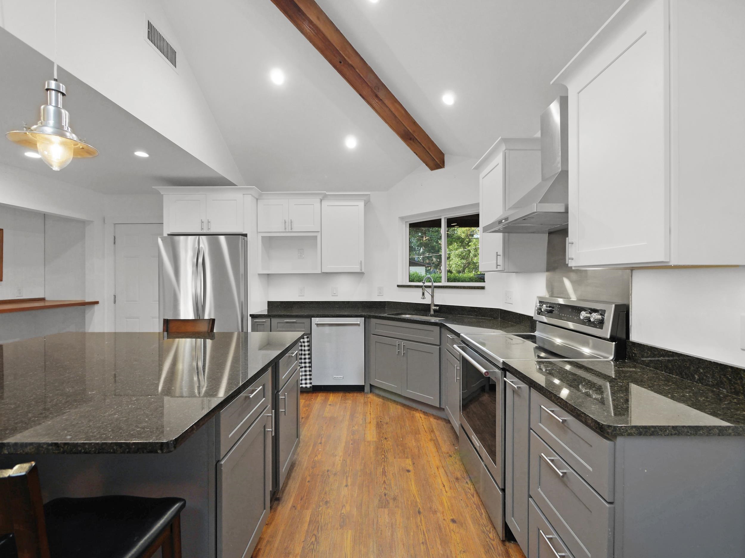 369 Orchis Road St. Augustine, FL 32086 - Photo 13 of 41 a kitchen with stainless steel appliances granite countertop a sink stove and refrigerator