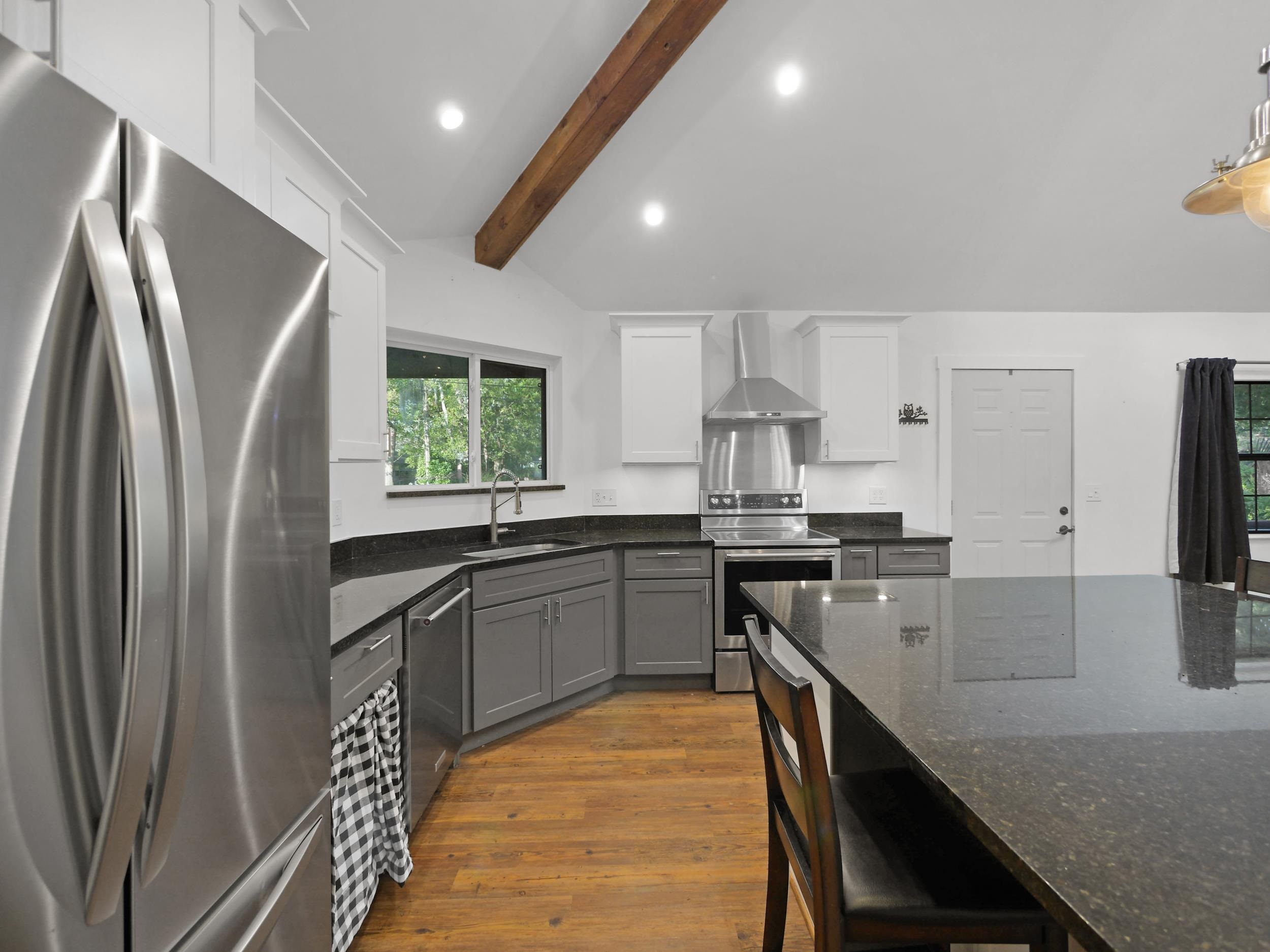 369 Orchis Road St. Augustine, FL 32086 - Photo 15 of 41 a kitchen with stainless steel appliances granite countertop a sink stove and refrigerator