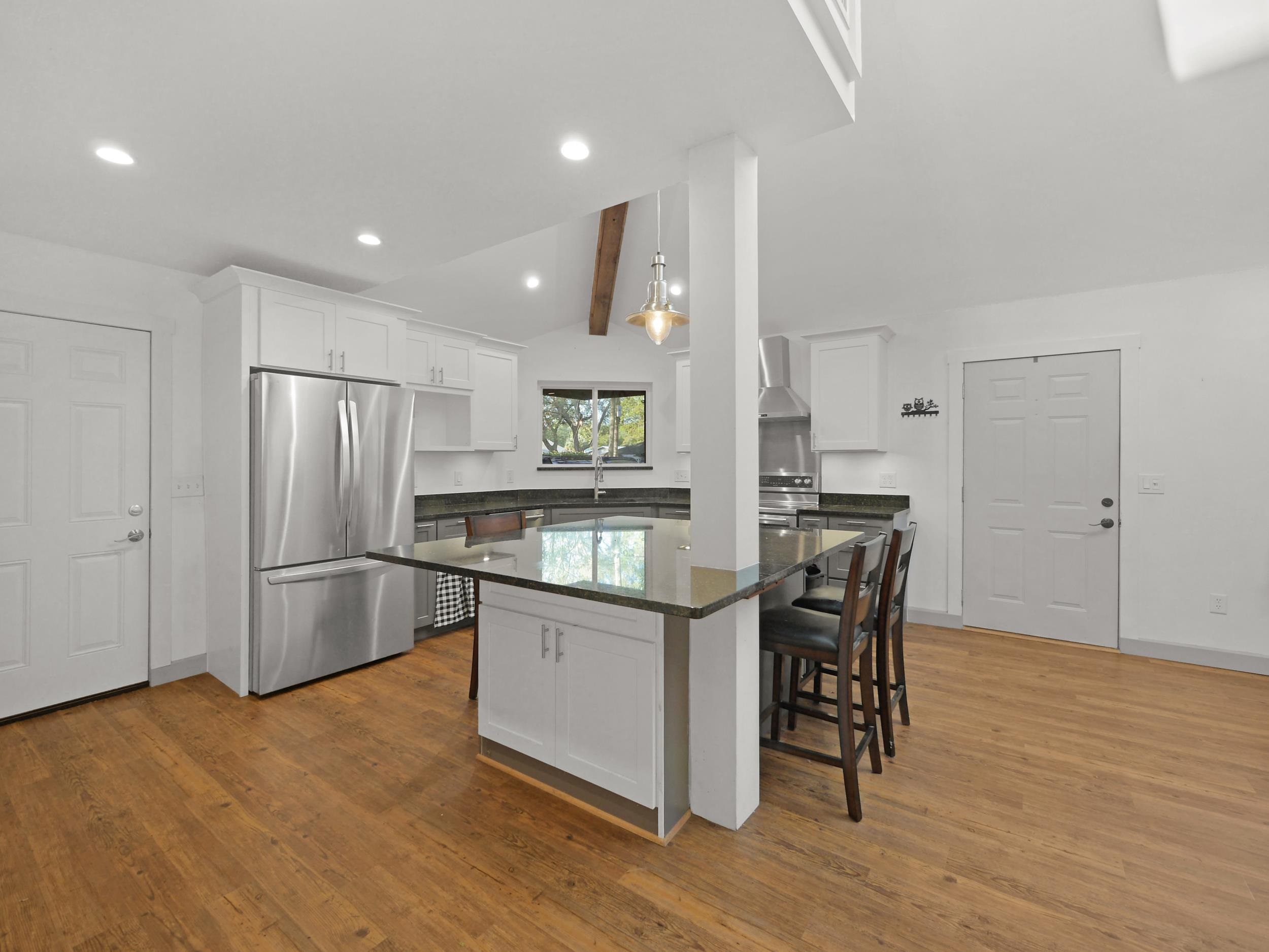 369 Orchis Road St. Augustine, FL 32086 - Photo 17 of 41 a kitchen with stainless steel appliances granite countertop a refrigerator and a stove top oven