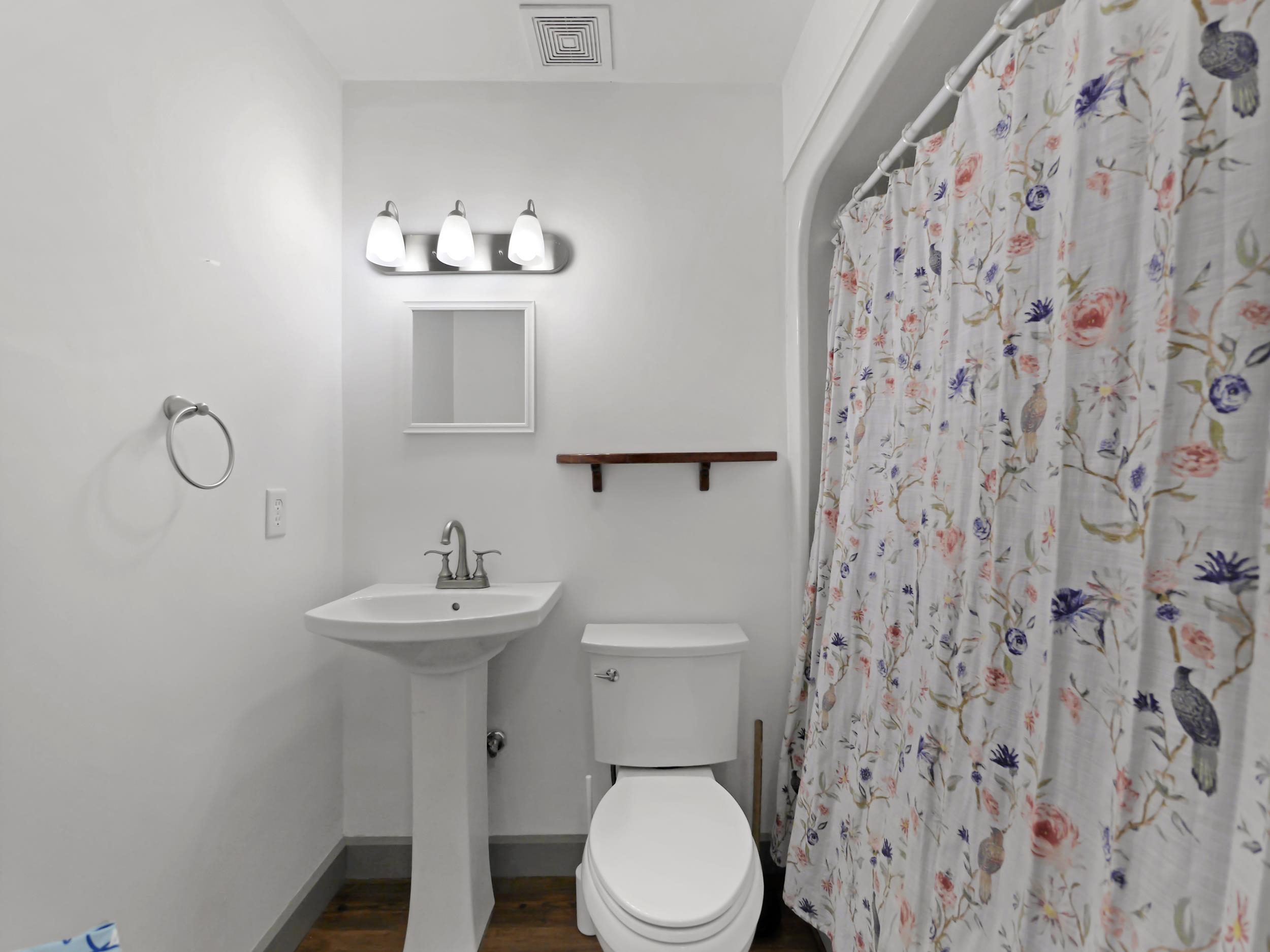 369 Orchis Road St. Augustine, FL 32086 - Photo 25 of 41 a bathroom with a sink toilet and a mirror