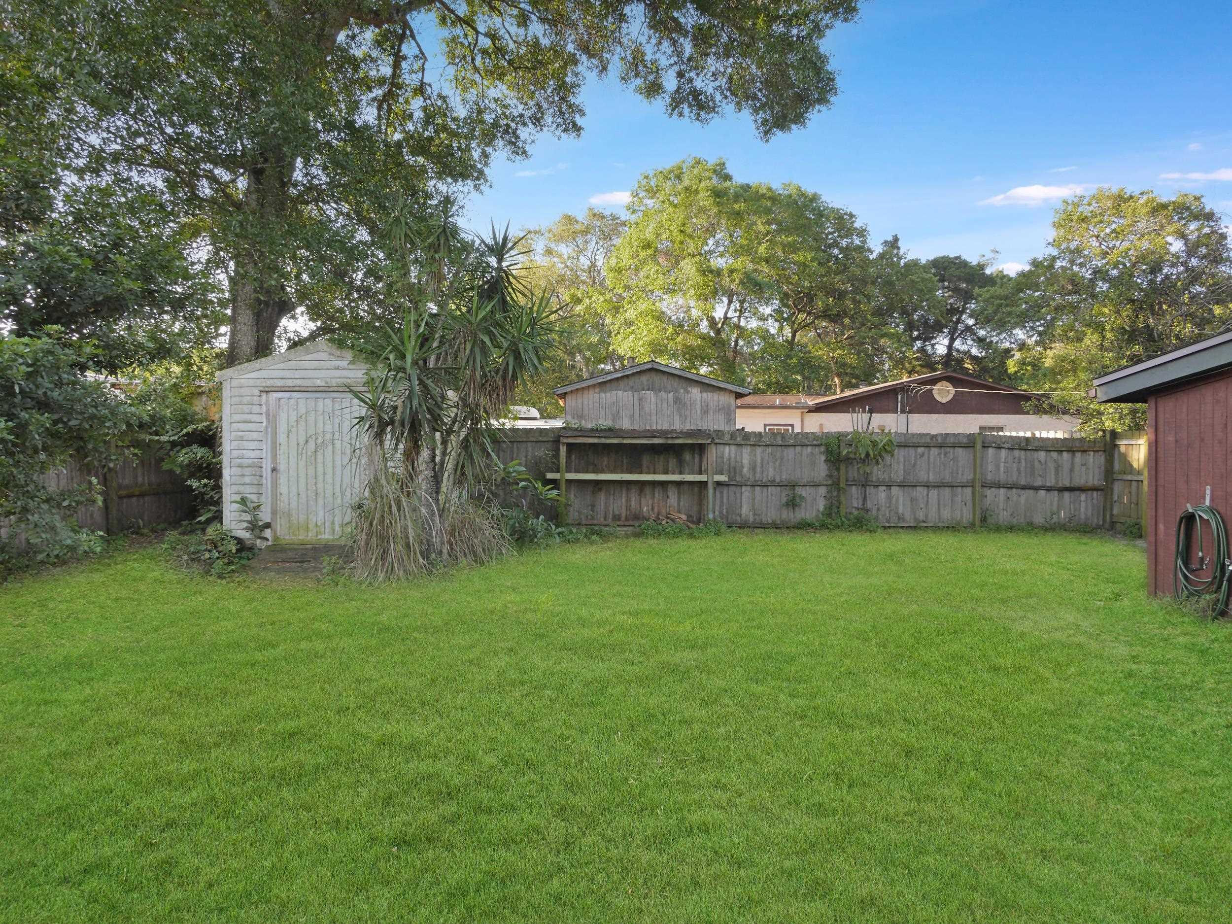 369 Orchis Road St. Augustine, FL 32086 - Photo 29 of 41 a view of a backyard with a garden