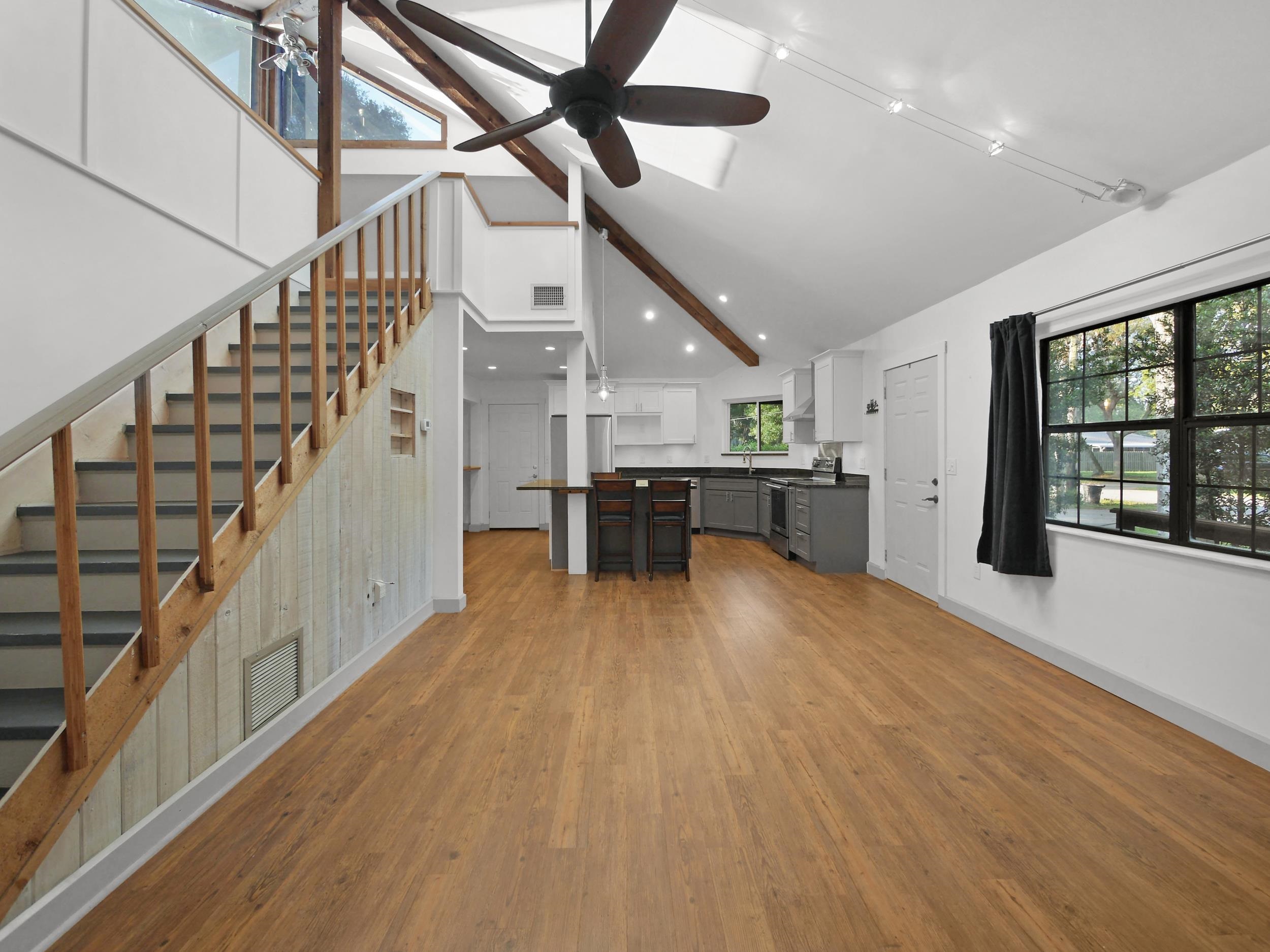 369 Orchis Road St. Augustine, FL 32086 - Photo 7 of 41 a view of empty room with wooden floor and windows
