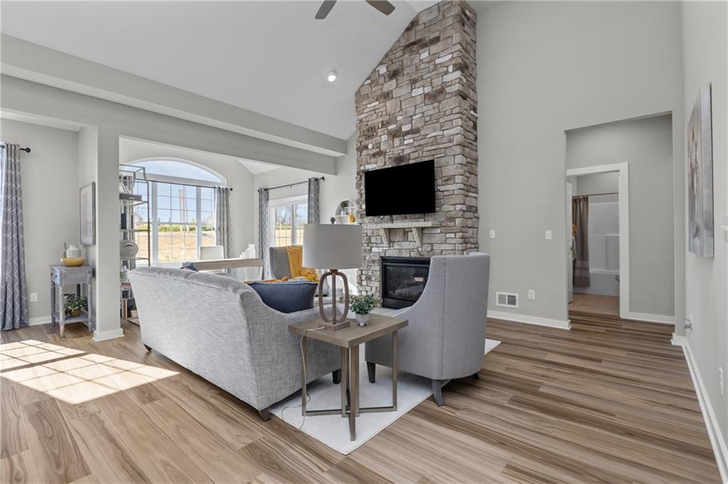 106 Independence Drive Cabot, PA 16023 - Photo 21 of 32 a living room with furniture a fireplace and a flat screen tv