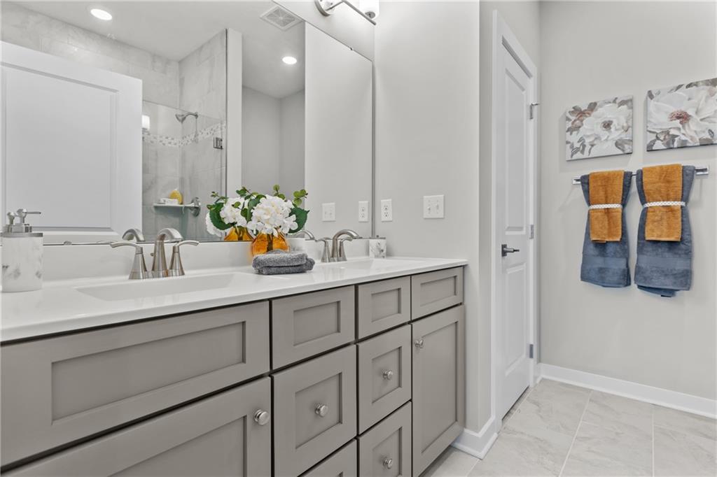 106 Independence Drive Cabot, PA 16023 - Photo 25 of 32 a bathroom with a sink and a mirror
