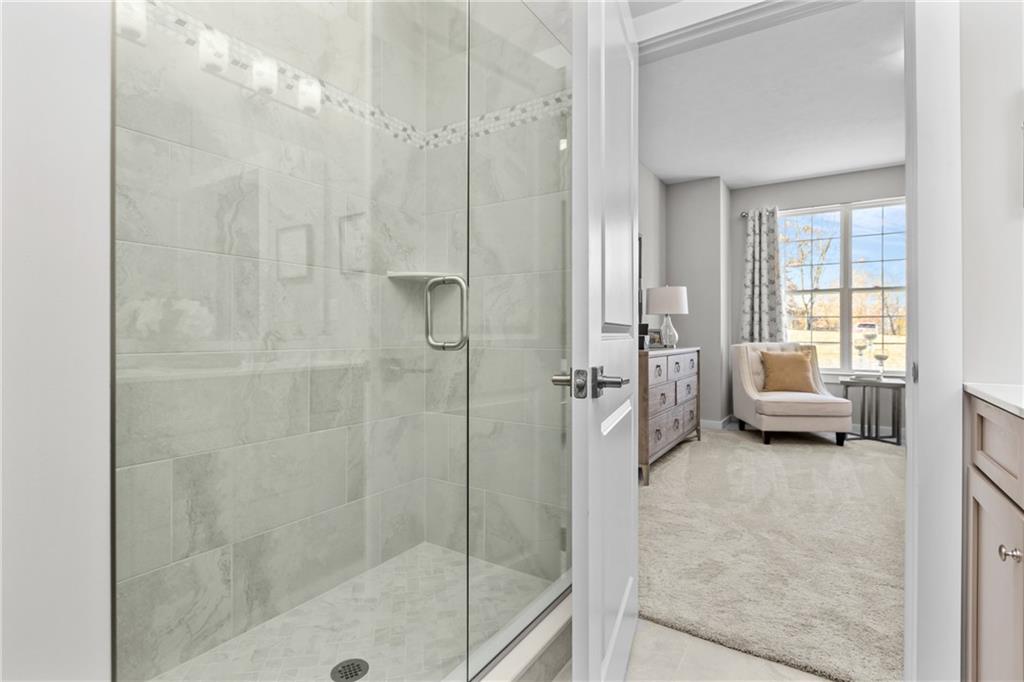 106 Independence Drive Cabot, PA 16023 - Photo 26 of 32 a en suite bathroom with a tub shower and bedroom