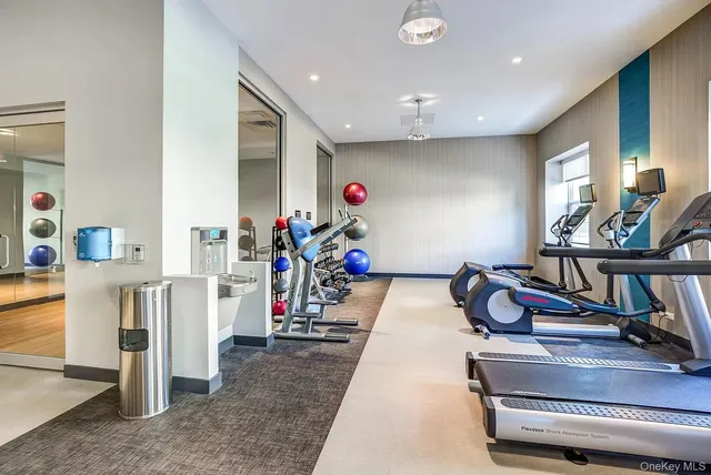 a hallway with lots of gym equipment