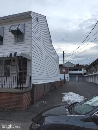 a roof deck with table and chairs