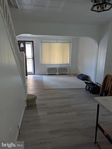 a room with a bed and window