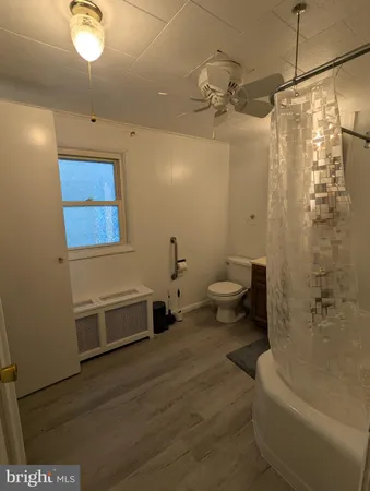 a bathroom with a toilet a sink and bathtub