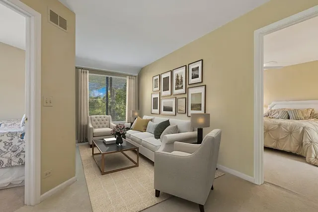 a bedroom with a bed couch and window