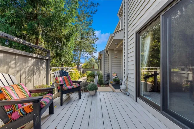 a view of a balcony with chairs