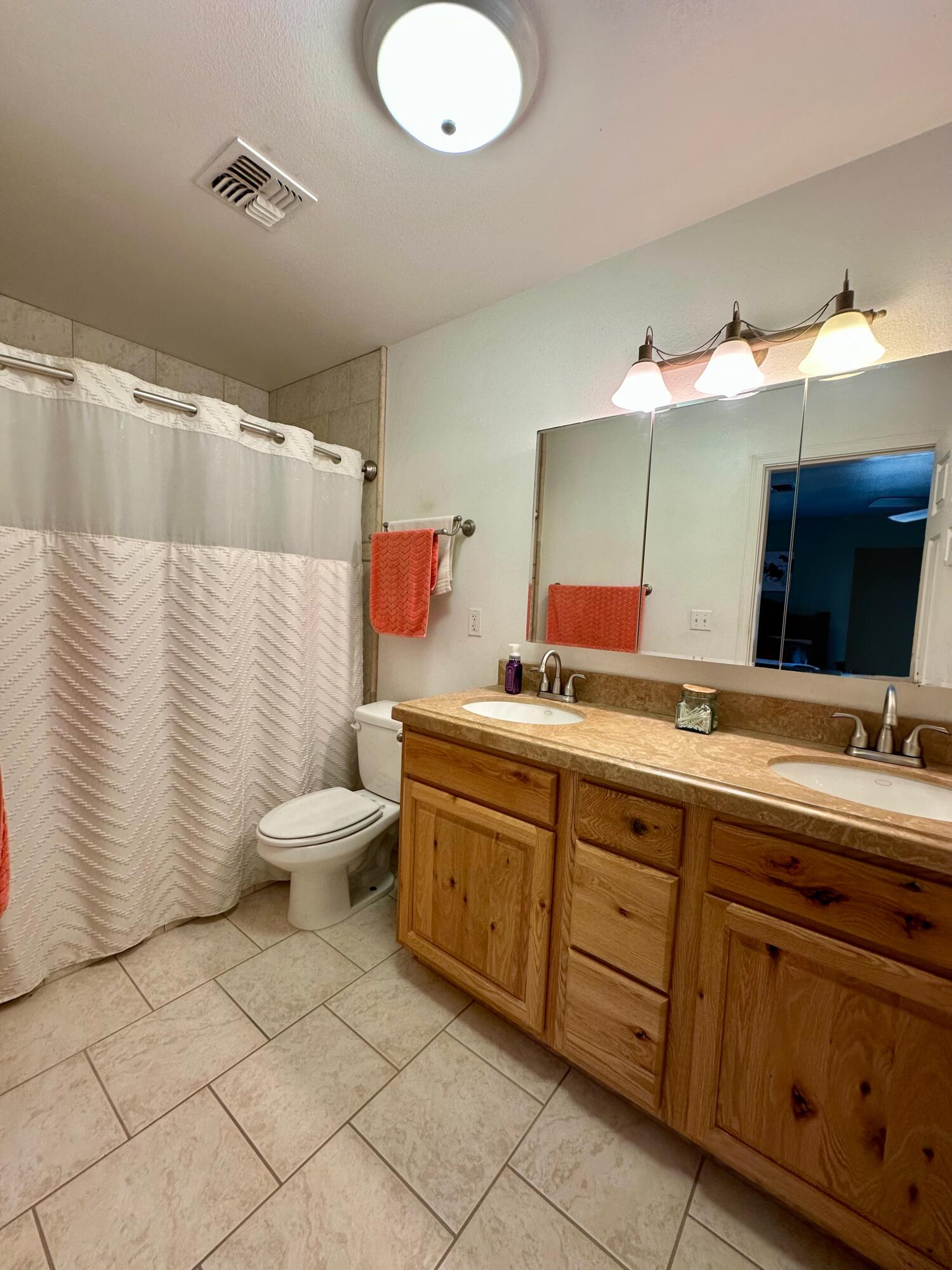 1731 Riviera Drive Blythe, CA 92225 - Photo 22 of 36 a spacious bathroom with a double vanity sink mirror and toilet