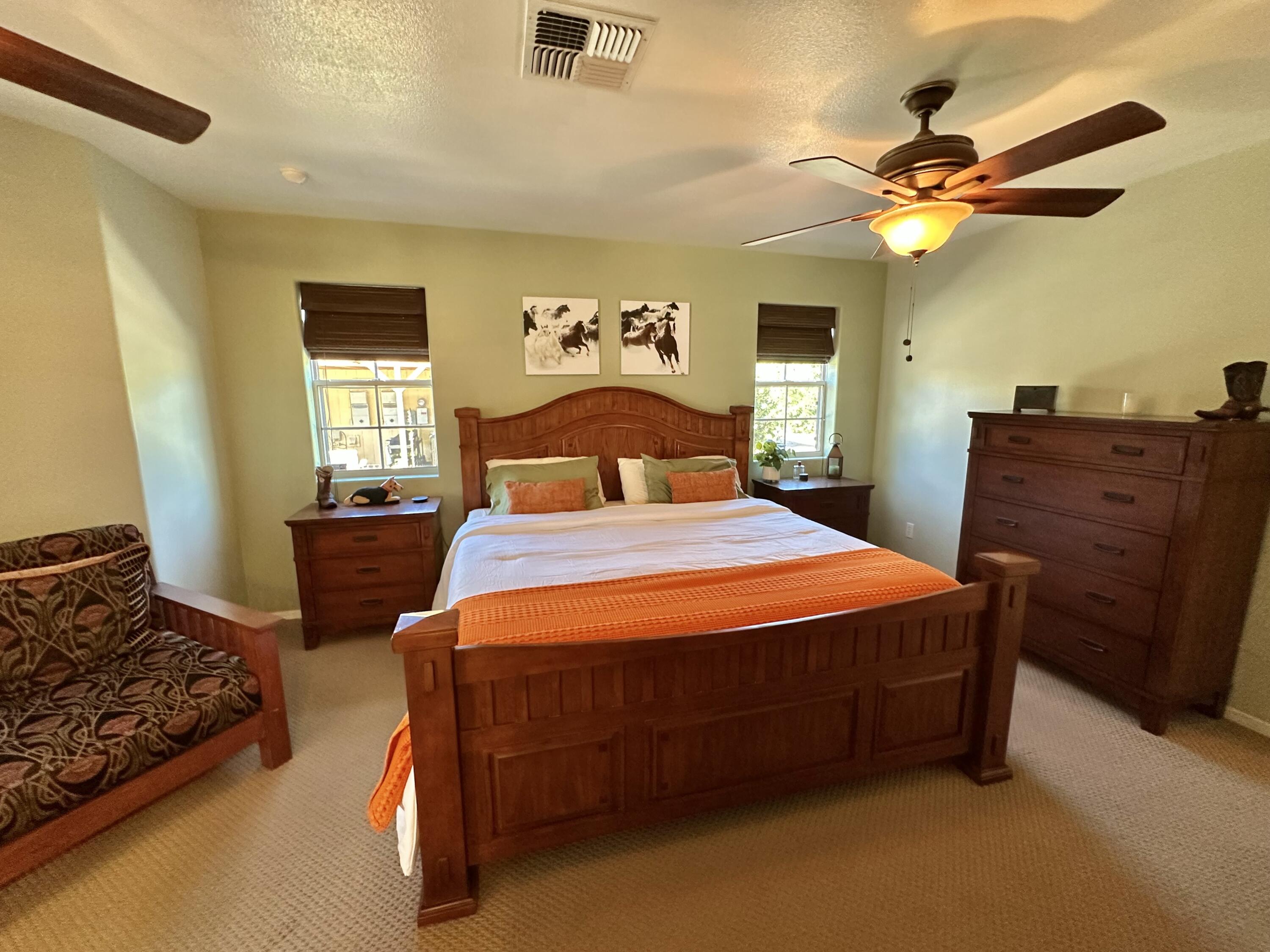 1731 Riviera Drive Blythe, CA 92225 - Photo 24 of 36 a bedroom with a bed and wooden floor