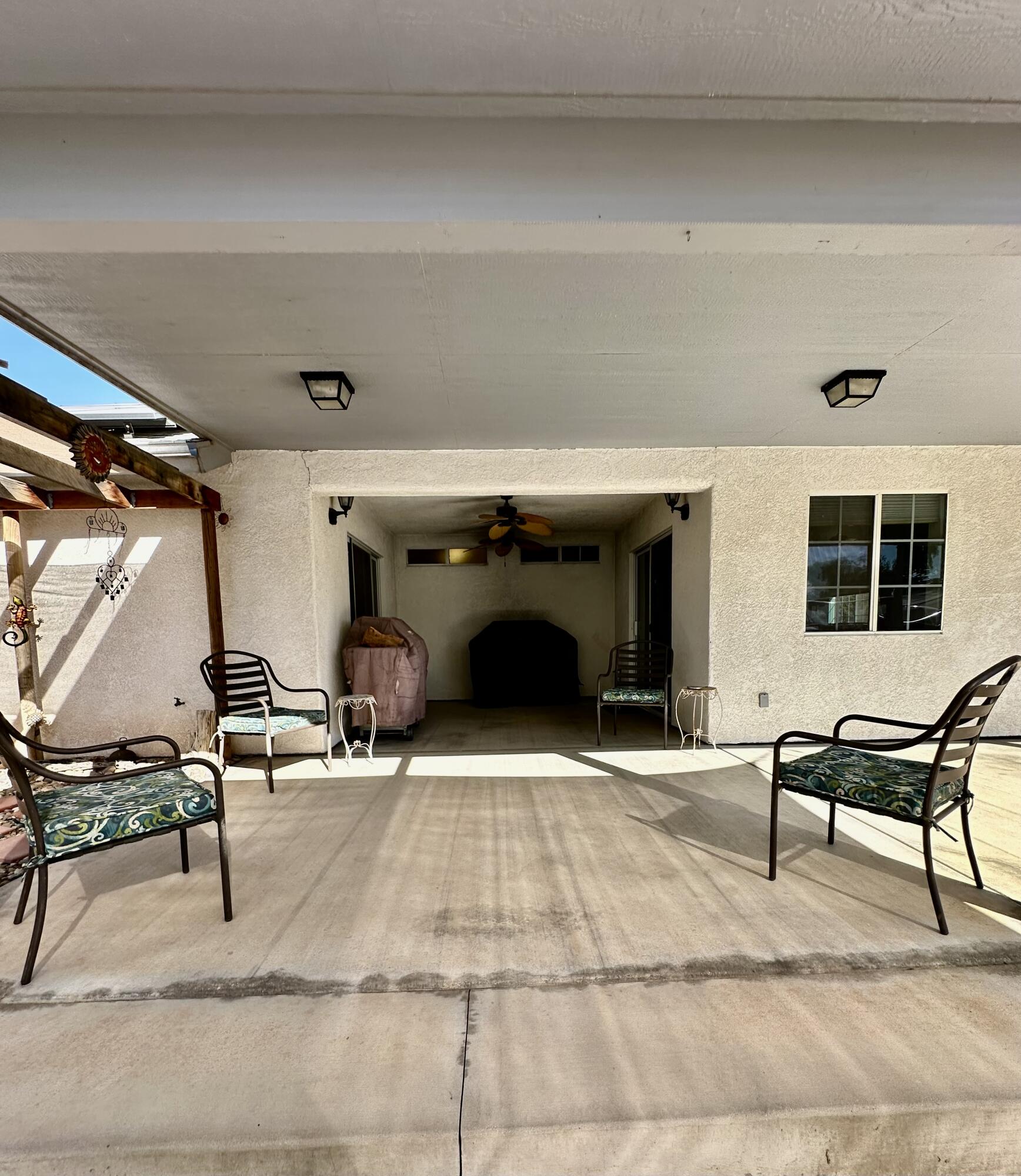 1731 Riviera Drive Blythe, CA 92225 - Photo 26 of 36 a living room with chairs and a fireplace